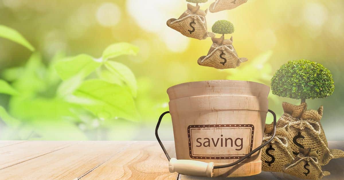 Money bags falling into bucket